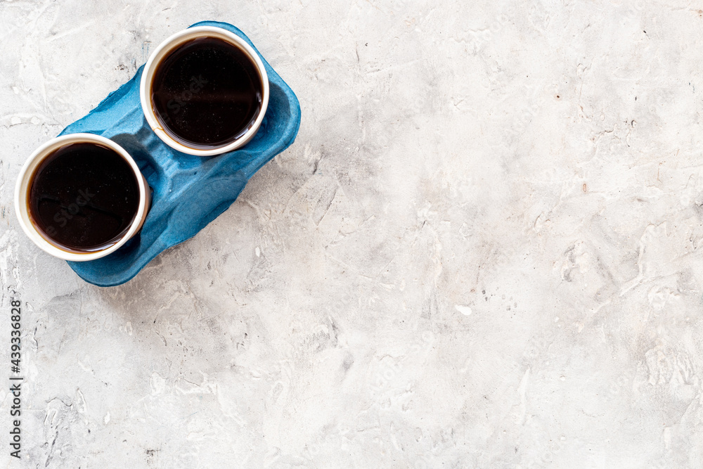 Coffee to go background. Black coffee in paper cups, top view Coffee to go background. Black coffee in paper cups, top view