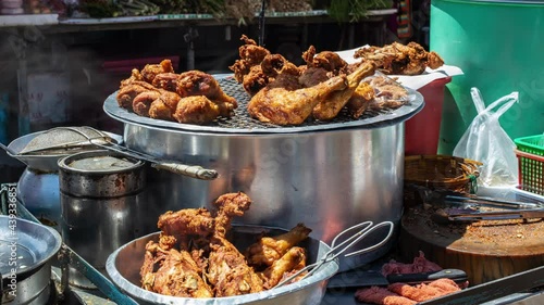 street food from Bangkok, fried chicken inside of khlong toei market photo