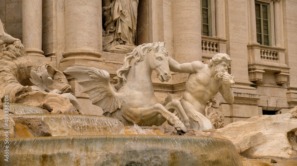 Rome. Detail of Trevi Fountain. A triton guide one of the two winged horses that pull Neptune's chariot.