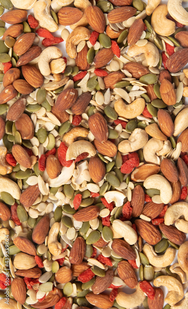 mixed organic cereal and grain seed pile on white background. healthy eating concept. pumpkin, sunflower seeds and legumes. mixed organic cereal and grain seed pile on white background. healthy eating concept. pumpkin, sunflower seeds and legumes.
