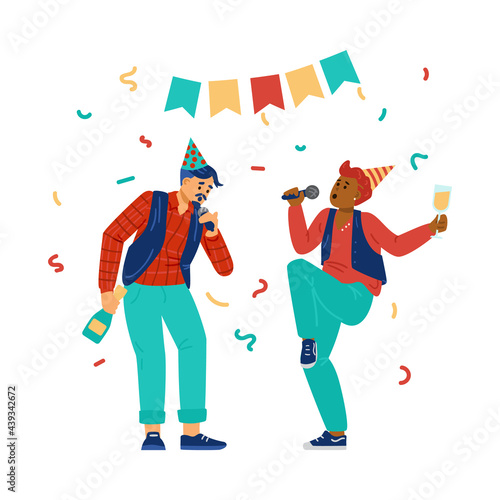 Two young persons with microphones sing holiday songs at karaoke or music party.