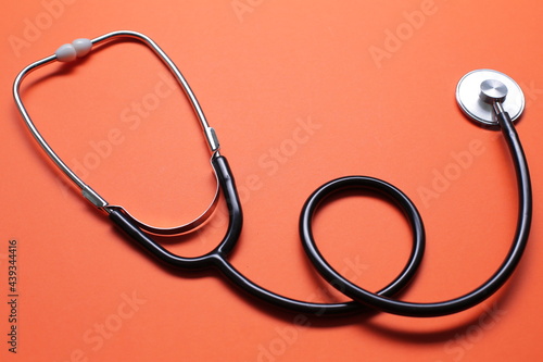 Blue medical stethoscope isolated on blue background