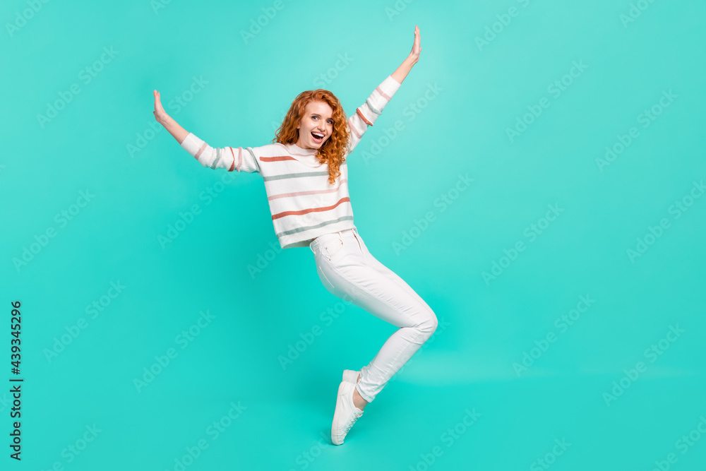 Fototapeta premium Full length body size view of pretty cheerful wavy-haired girl dancing fooling having fun isolated over bright teal turquoise color background