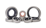 Group of rubber reinforced oil seals for shafts and for car motor engines, isolated on white background. Cuffs for prevent liquid leak. Car parts.