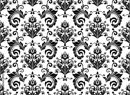 Wallpaper in the style of Baroque. Seamless vector background. White and black floral ornament. Graphic pattern for fabric, wallpaper, packaging. Ornate Damask flower ornament