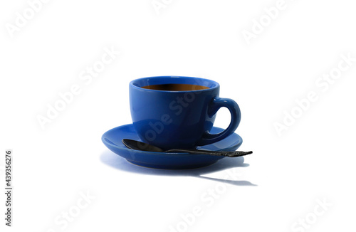 Blue tea cup and tea saucer with iron teaspoon isolated on white background