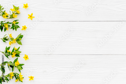 Floral background of yellow flowers with leaves  overhead view