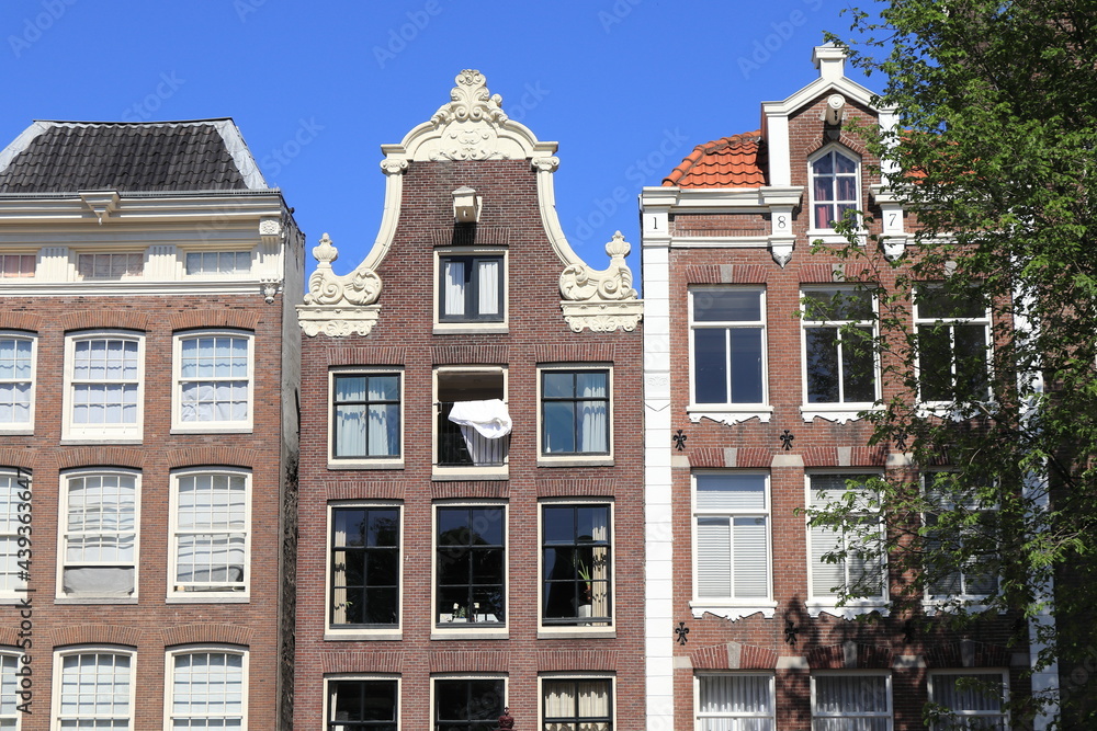 Amsterdam Canal House Facades with Duvet Airing From a Window