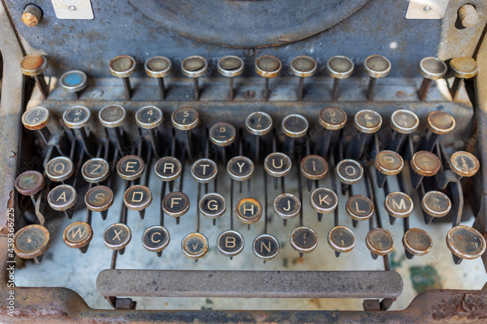 close-up antique ruined typewriter keys, vintage machine