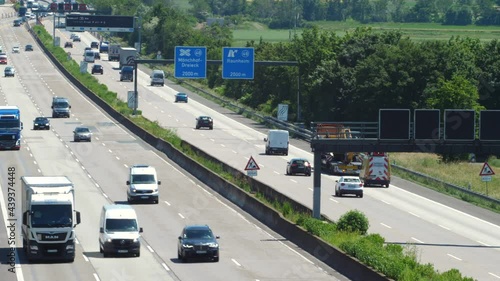 Weilbach, Germany - June 14, 2021: Large trucks and dense traffic on autobahn A3 near Wiesbadener Kreuz. The Bundesautobahn 3 (abbreviated as BAB 3 or A 3) is a highway in Germany that links the borde
