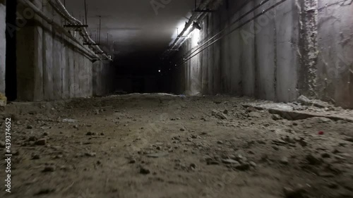 Steady shot of a scarry abandoned underground bunker photo
