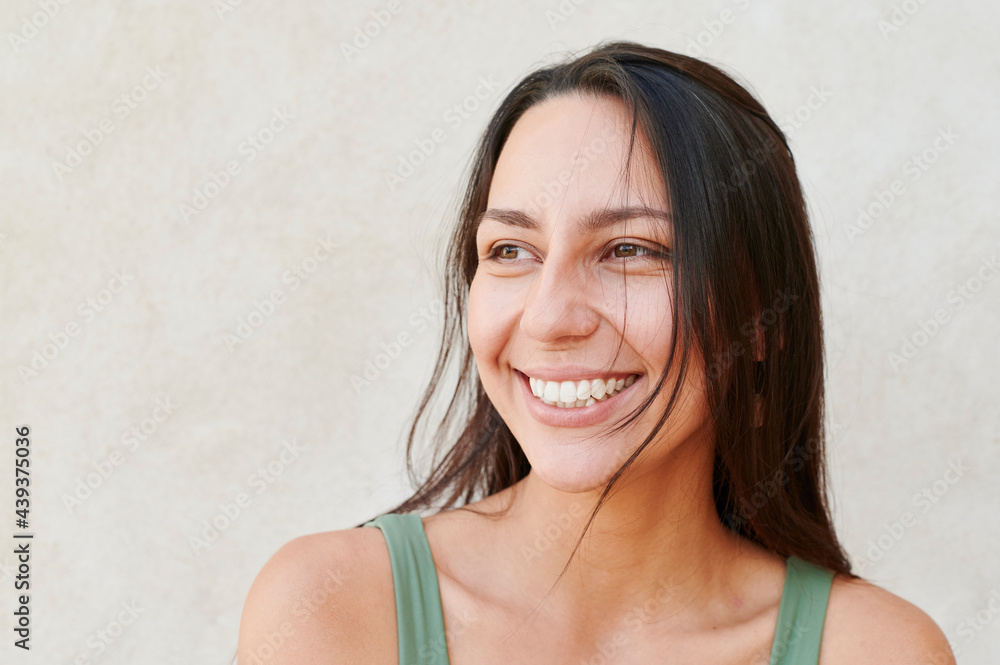 Young woman smiling outside in the summer Young woman smiling outside in the summer