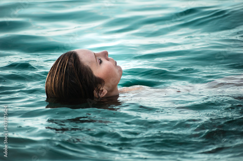 girl's portrait relaxing in the sea