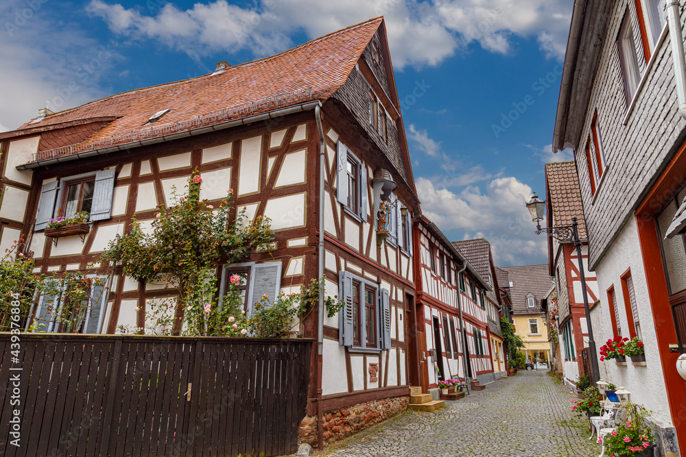Ancient town Seligenstadt, Germany.  Street of the old city. Colorful half-timbered houses.