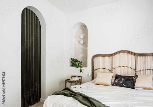 Cane bed and arched doorway photo