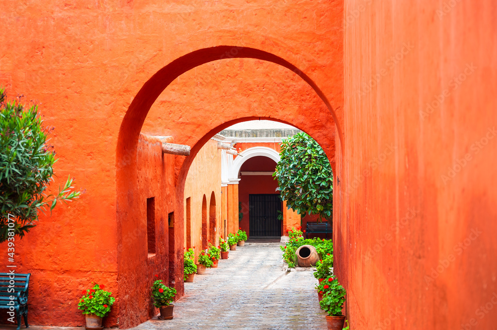 Red painted walls of Santa Catalina monastery in Arequipa, Peru. National architecture of South America