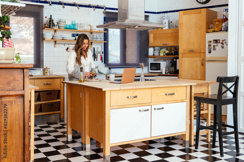 Woman cooking breakfast at home Woman cooking breakfast at home