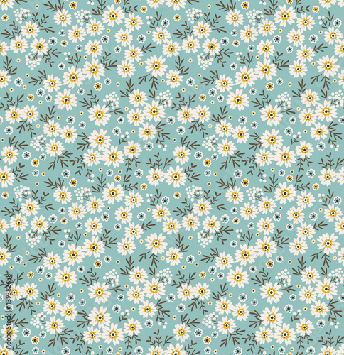 Seamless floral pattern. Ditsy background of small white  flowers. Small-scale flowers scattered over a pale blue background. Stock vector for printing on surfaces and web design.