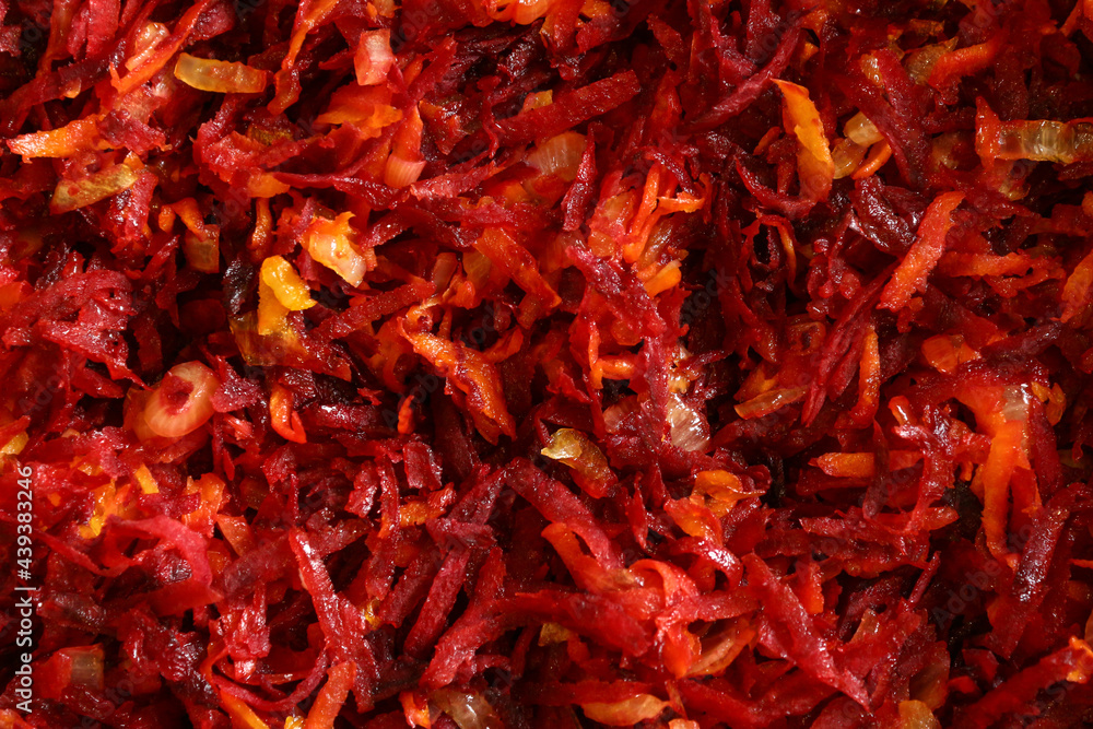 Fototapeta premium Color photograph of sliced beets, carrots and onions. Healthy vegetables with vitamins. Vegetarianism and veganism.