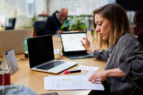 Woman reading business report