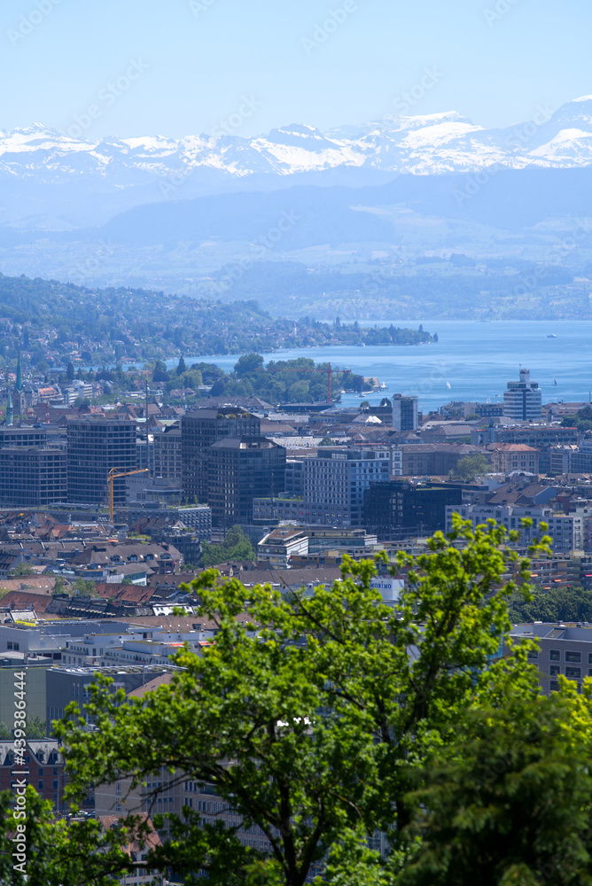 Panorama view over the City of Zurich with lake Zurich and Swiss alps in the background at a beautiful summer day. Photo taken June 14th, 2021, Zurich, Switzerland.