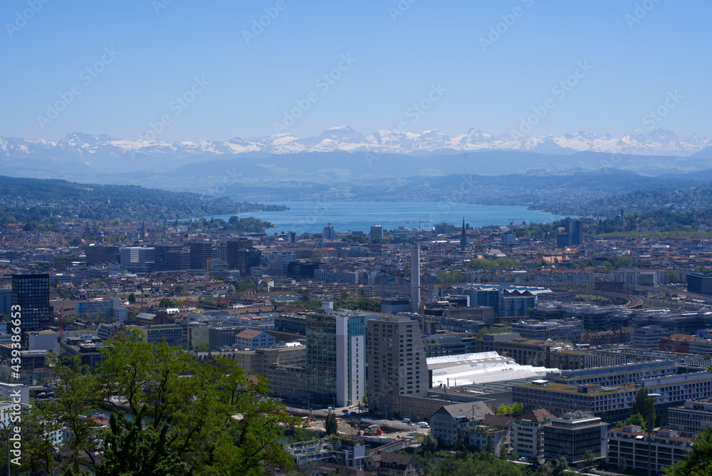 Panorama view over the City of Zurich with lake Zurich and Swiss alps in the background at a beautiful summer day. Photo taken June 14th, 2021, Zurich, Switzerland.