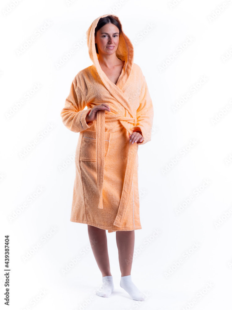 woman in a Bathrobe on an isolated white background with a smile on her face. woman in a Bathrobe on an isolated white background with a smile on her face.