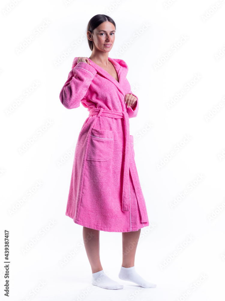 woman in a Bathrobe on an isolated white background with a smile on her face. woman in a Bathrobe on an isolated white background with a smile on her face.