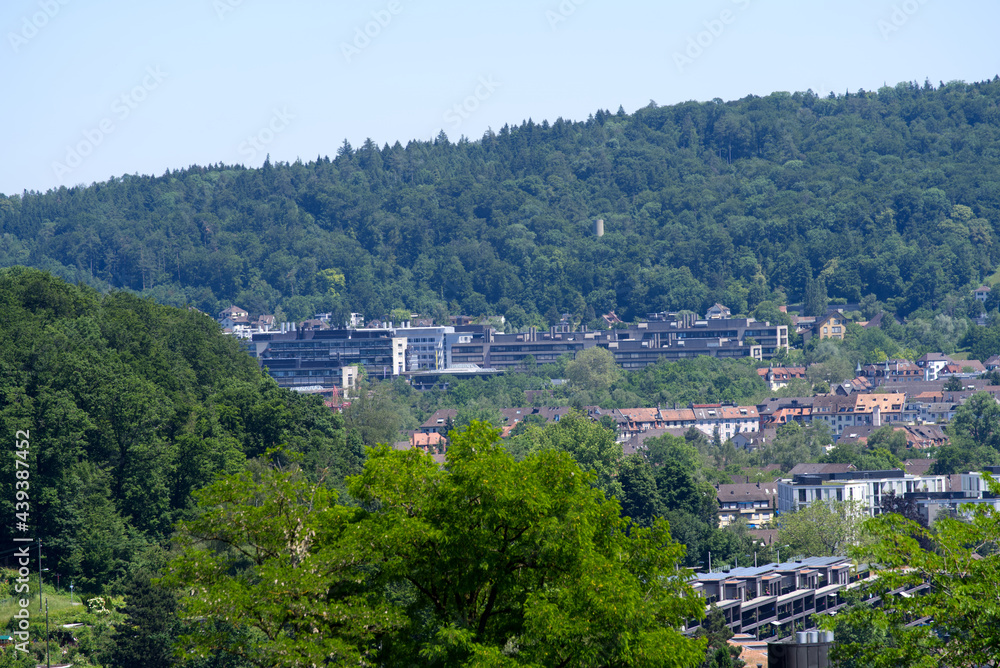 Panorama view over the City of Zurich with mountains in the background at a beautiful summer day. Photo taken June 14th, 2021, Zurich, Switzerland.