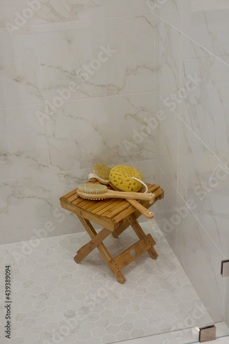 Luxury spa setting in master bath with stool, scrub brush and sponge photo