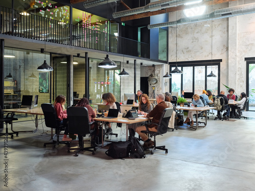 People working in open space office