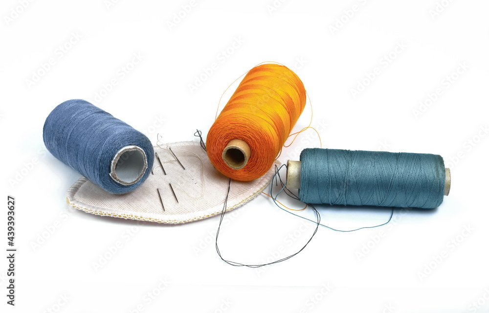 Color sewing threads isolated on white background. Color sewing threads isolated on white background.