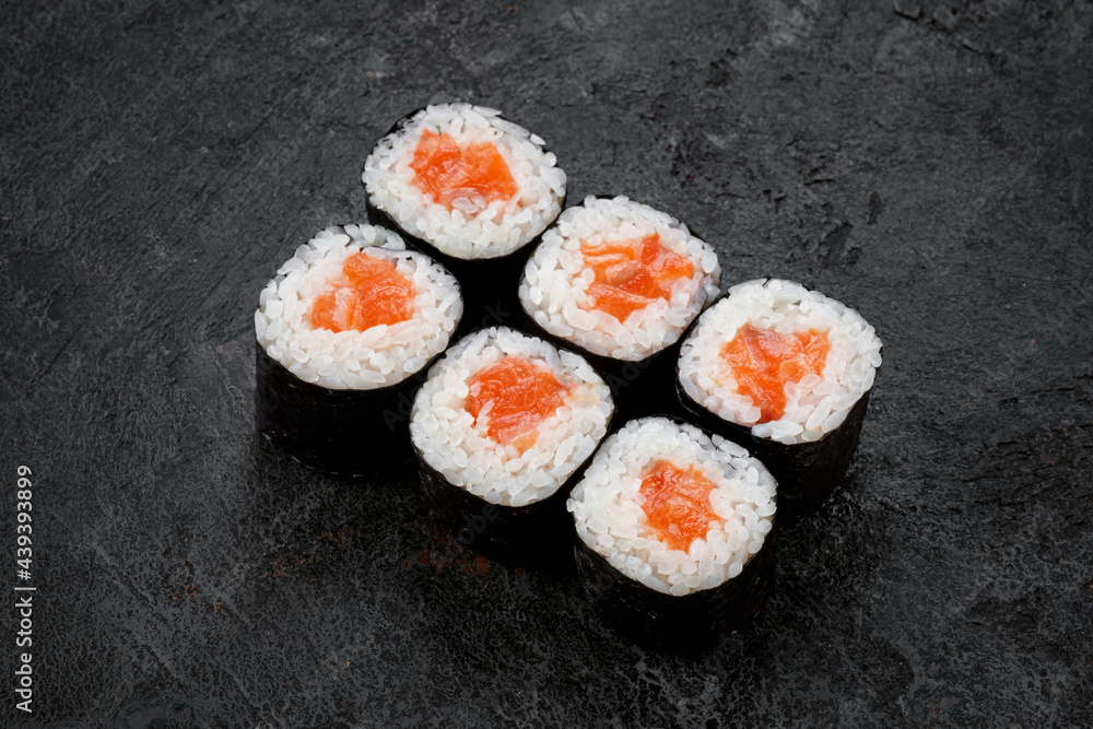 Sake maki Japanese roll with Salmon on stone. sushi-roll Sake maki Japanese roll with Salmon on stone. sushi-roll