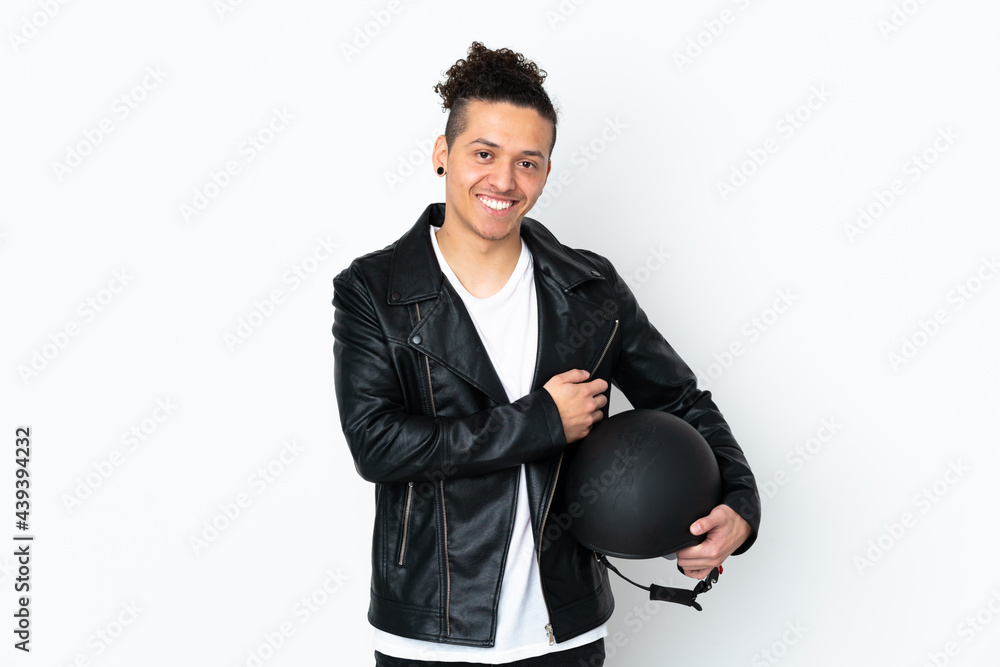 Caucasian man with a motorcycle helmet over isolated white background laughing Caucasian man with a motorcycle helmet over isolated white background laughing