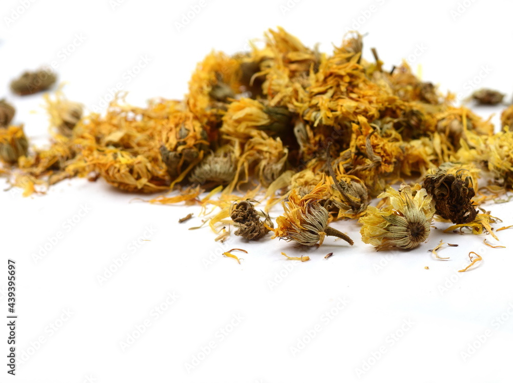 Calendula officinalis or Marigold dry tea flowers isolated. Calendula or pot marigold medicinal herbs on white background Calendula officinalis or Marigold dry tea flowers isolated. Calendula or pot marigold medicinal herbs on white background