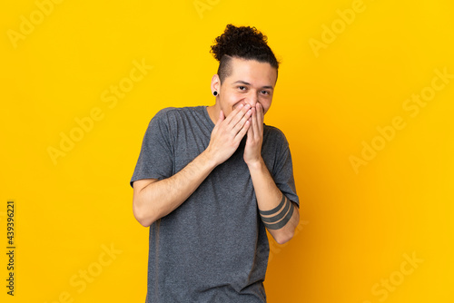 Caucasian man over isolated background happy and smiling covering mouth with hands