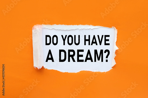 Do you Have a Dream? text on white paper near torn orange paper