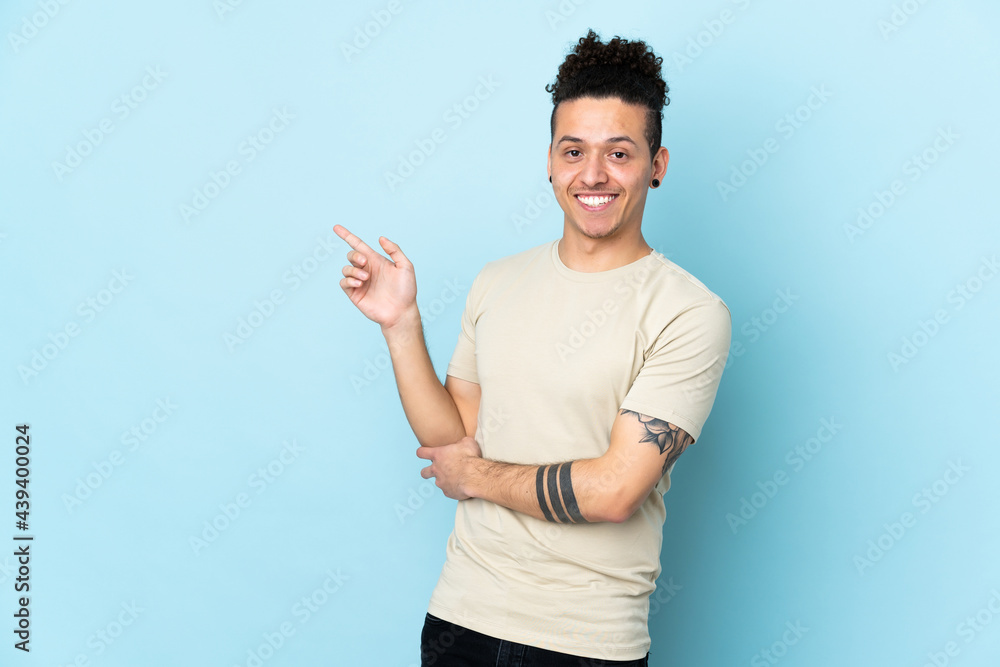 Caucasian man over isolated background pointing finger to the side Caucasian man over isolated background pointing finger to the side