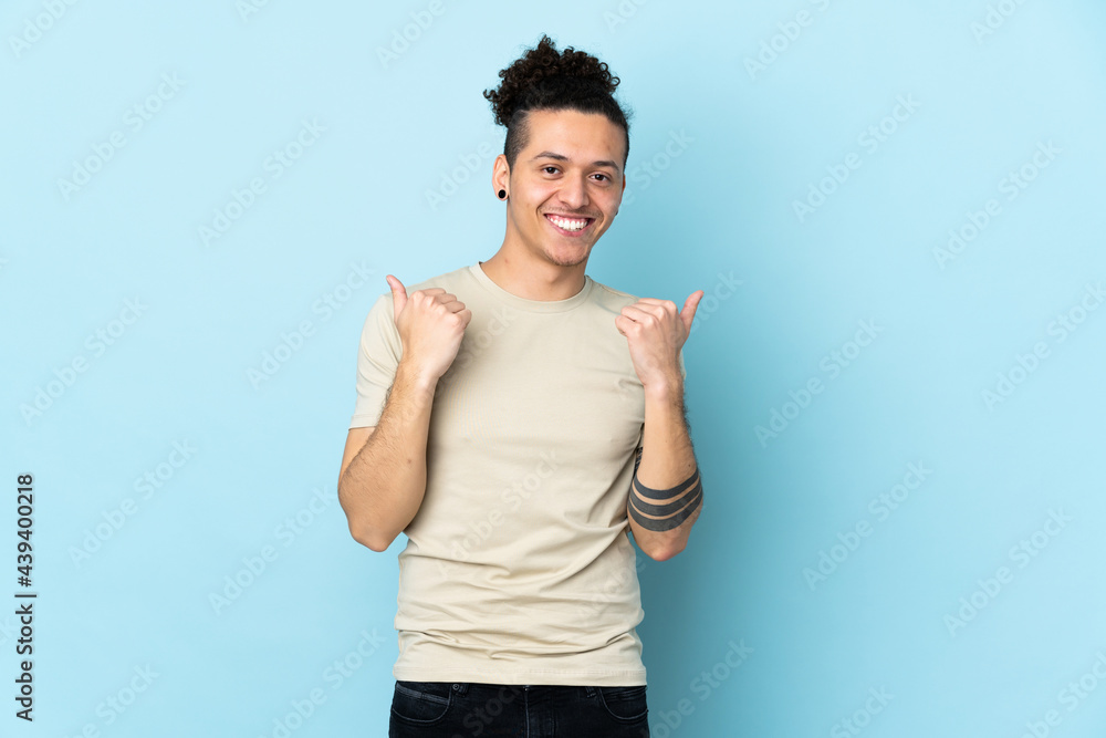 Caucasian man over isolated background with thumbs up gesture and smiling Caucasian man over isolated background with thumbs up gesture and smiling