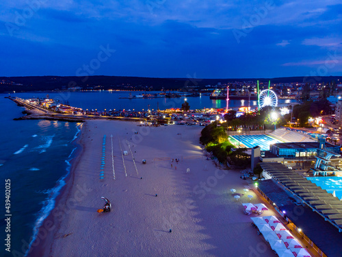 View from above of the port and beach in night Varna in Bulgaria. Summer holiday in Europe. Aerial photography, drone view.