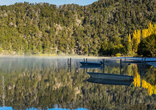 LAKE MIRROR, ROAD OF THE SEVEN LAKES. VILLA LA ANGOSTURA, PATAGONIA ARGENTINA. BOAT ON THE LAKE.