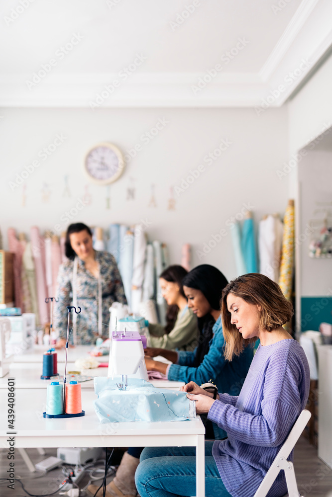 Seamstresses Using Sewing Machine Seamstresses Using Sewing Machine