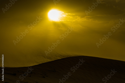 sunset over the desert, sand storm