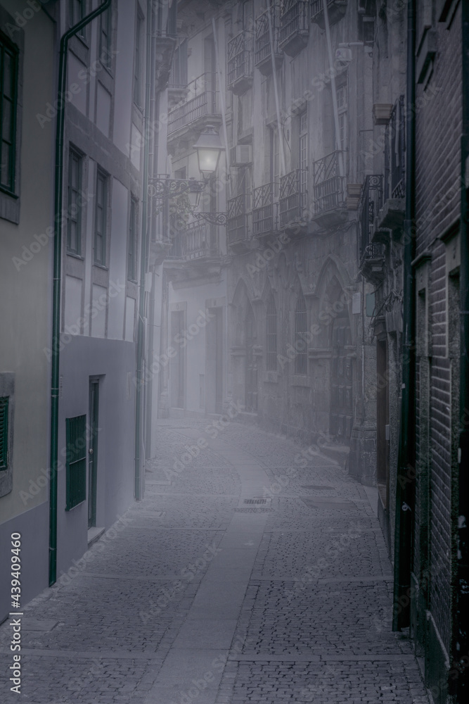 Foffy narrow street at dawn