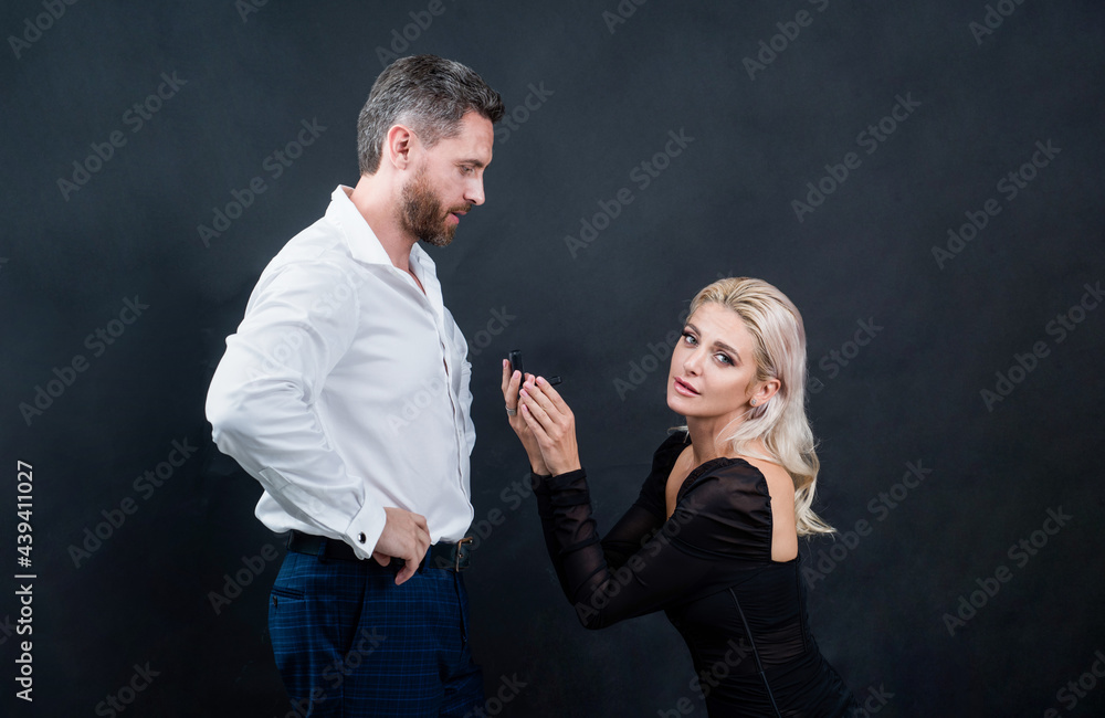 couple in love of woman making marriage proposal to man with engagement ring in box, valentines day couple in love of woman making marriage proposal to man with engagement ring in box, valentines day
