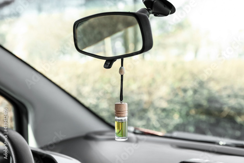 Air freshener hanging in car, closeup