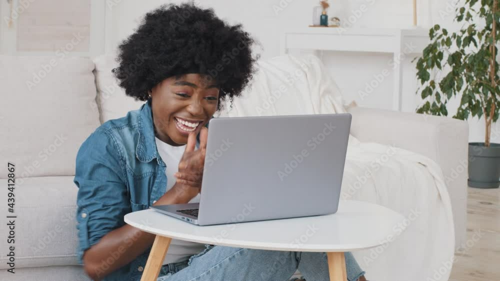 Happy overjoyed African woman read great news feel good surprise about job opportunity. Student girl get online test result scholarship on computer feel winner using look at laptop celebrate success Happy overjoyed African woman read great news feel good surprise about job opportunity. Student girl get online test result scholarship on computer feel winner using look at laptop celebrate success