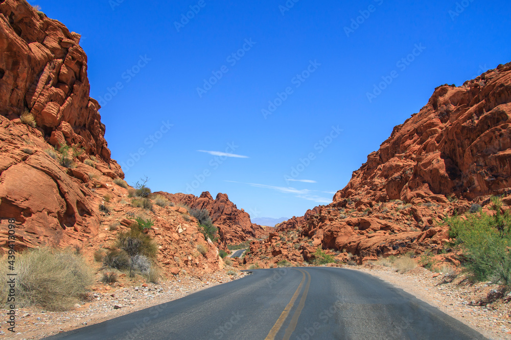 Road going through the middle of a canyon desert