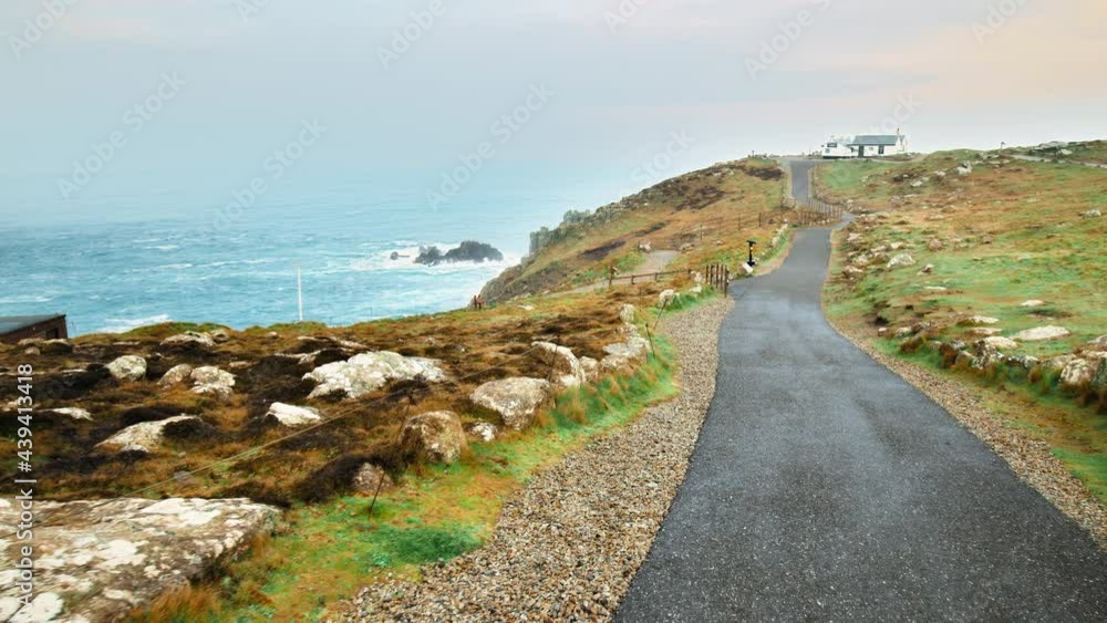 Beautiful scenic footpath on a landscape with green grass and hills in 4K. A natural sidewalk in the middle of nature in Cornwall, England, the United Kingdom. Beautiful scenic footpath on a landscape with green grass and hills in 4K. A natural sidewalk in the middle of nature in Cornwall, England, the United Kingdom.