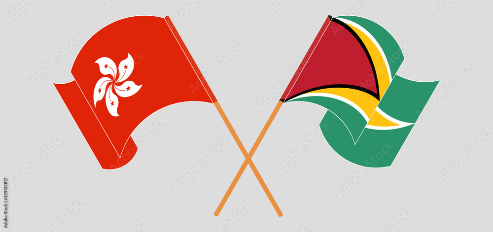 Crossed and waving flags of Hong Kong and Guyana Crossed and waving flags of Hong Kong and Guyana